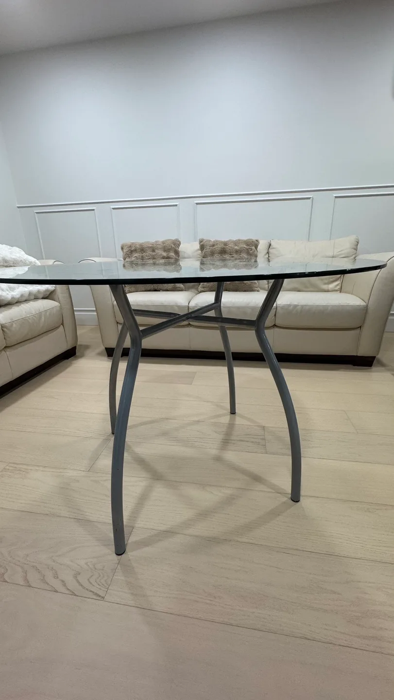 Glass top coffee table with unique curved metal legs image indicator(3)