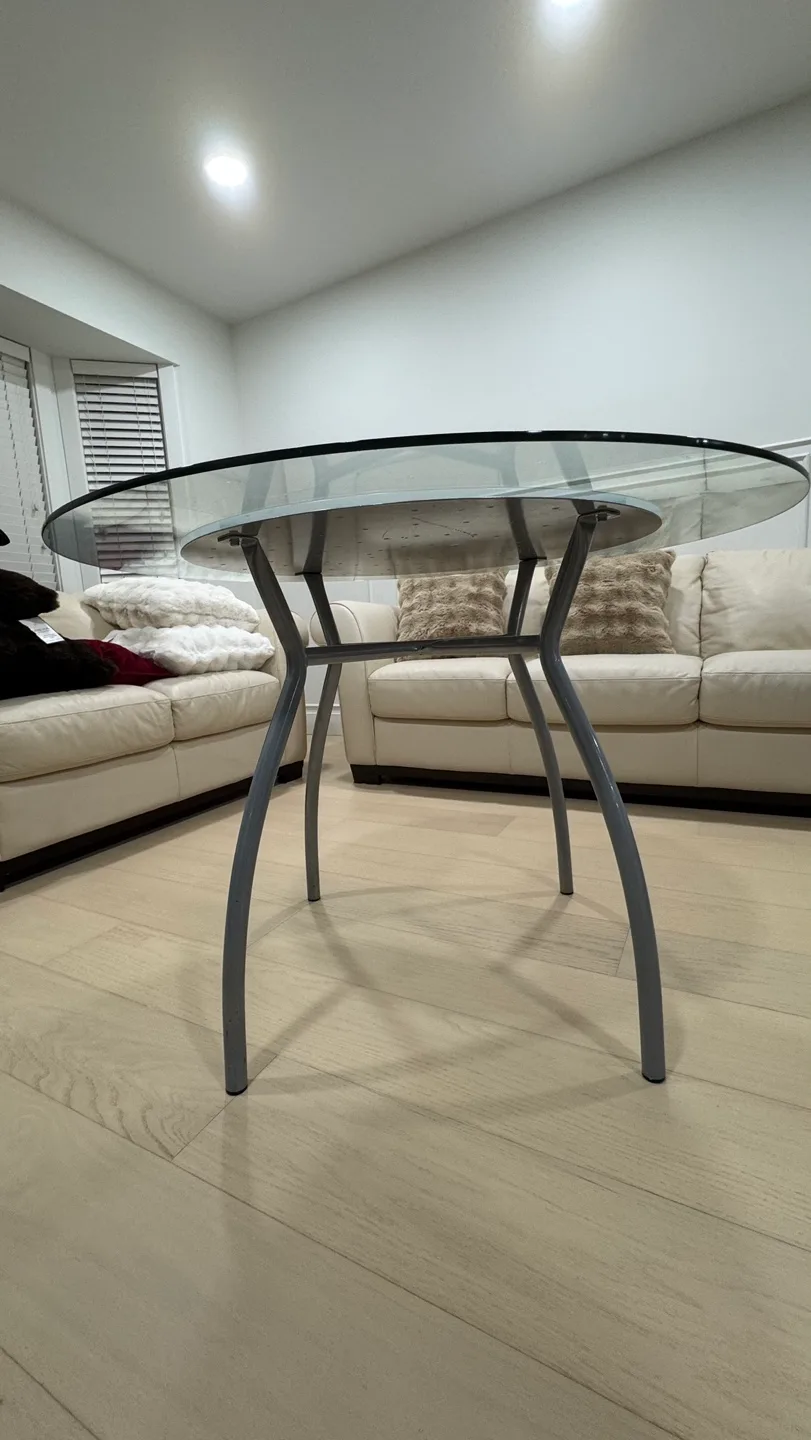 Glass top coffee table with unique curved metal legs image indicator(4)