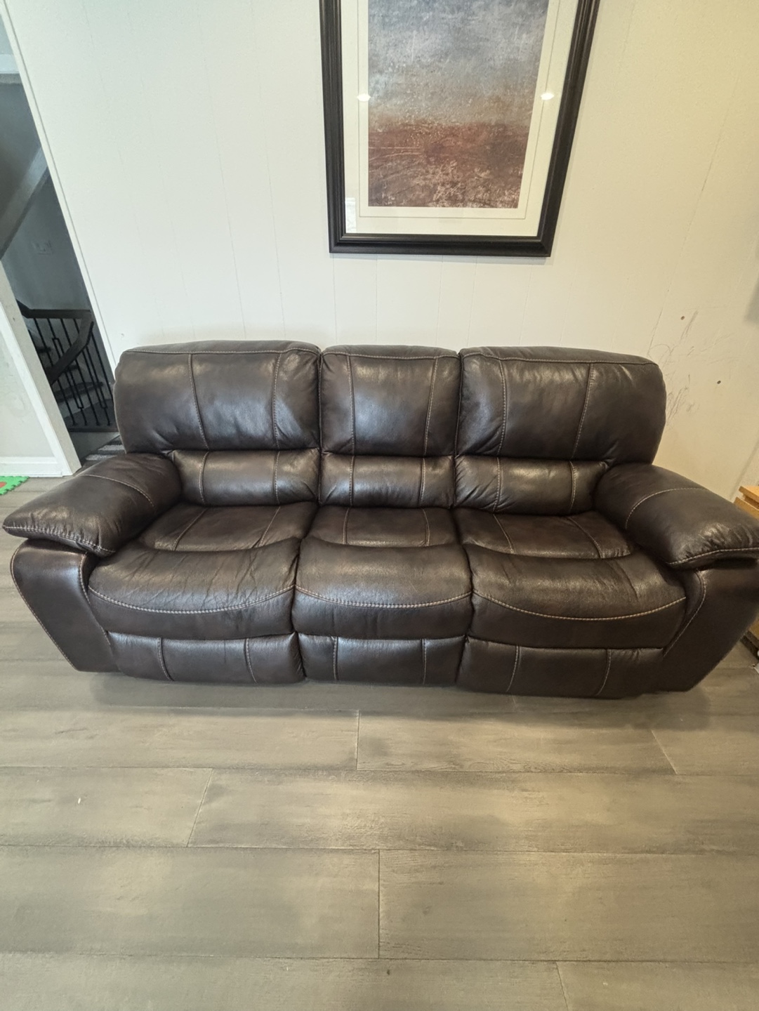 Leon’s - Brown Leather Reclining Sofa