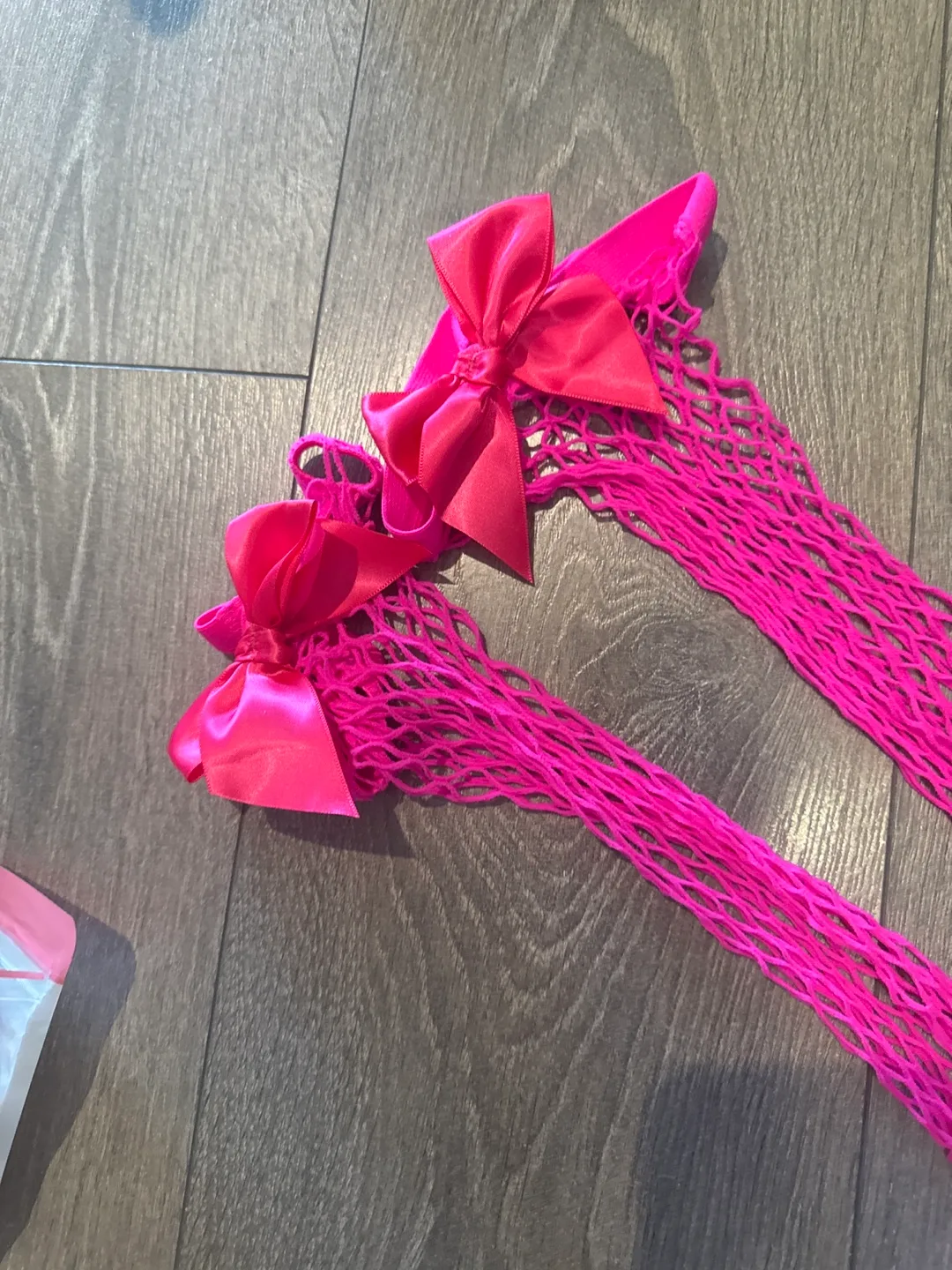 NEW Hot Pink Fishnet Thigh Highs with Bows image indicator(2)