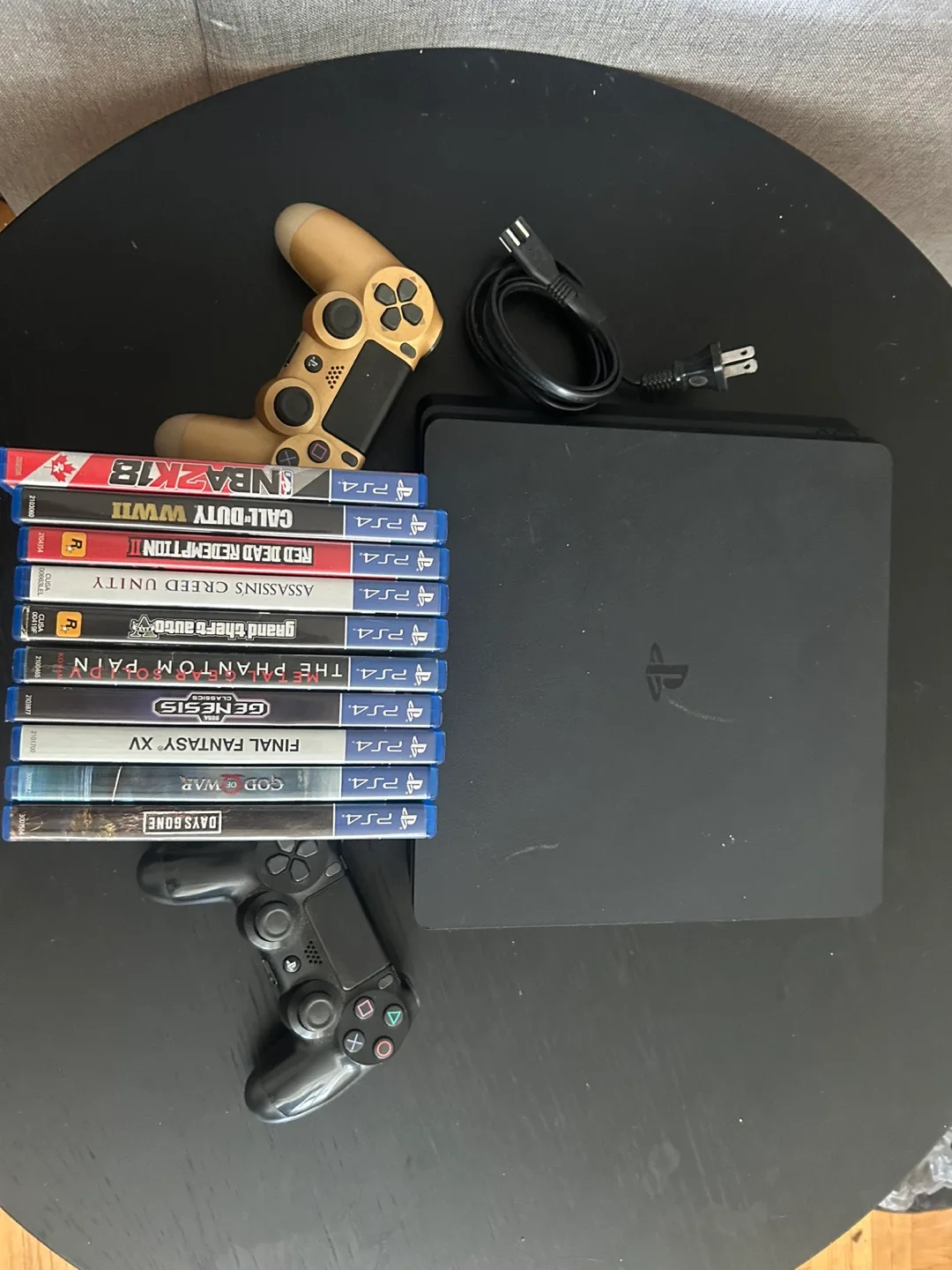 PS4 Slim with 10 Games and 2 Controllers image indicator(3)