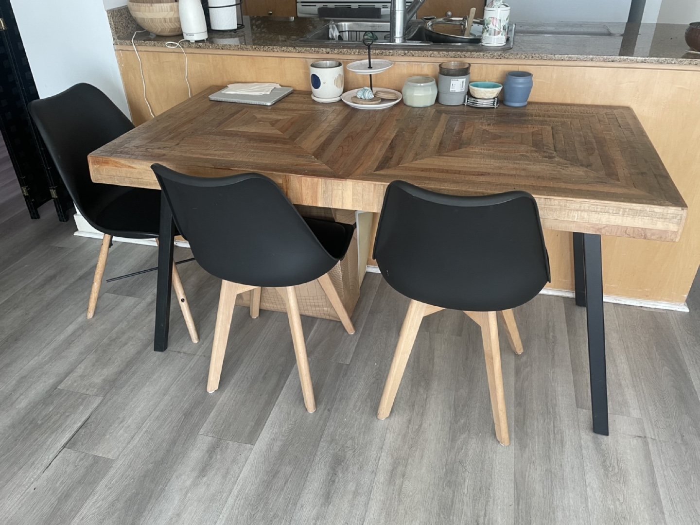 Wooden Dining Table with Two Black Chairs