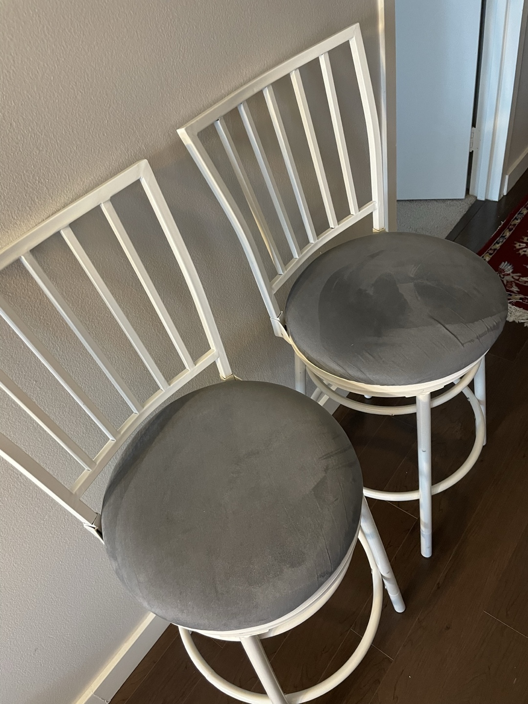 Pair of White Metal Swivel Bar Stools with Grey Cushions - photo 2