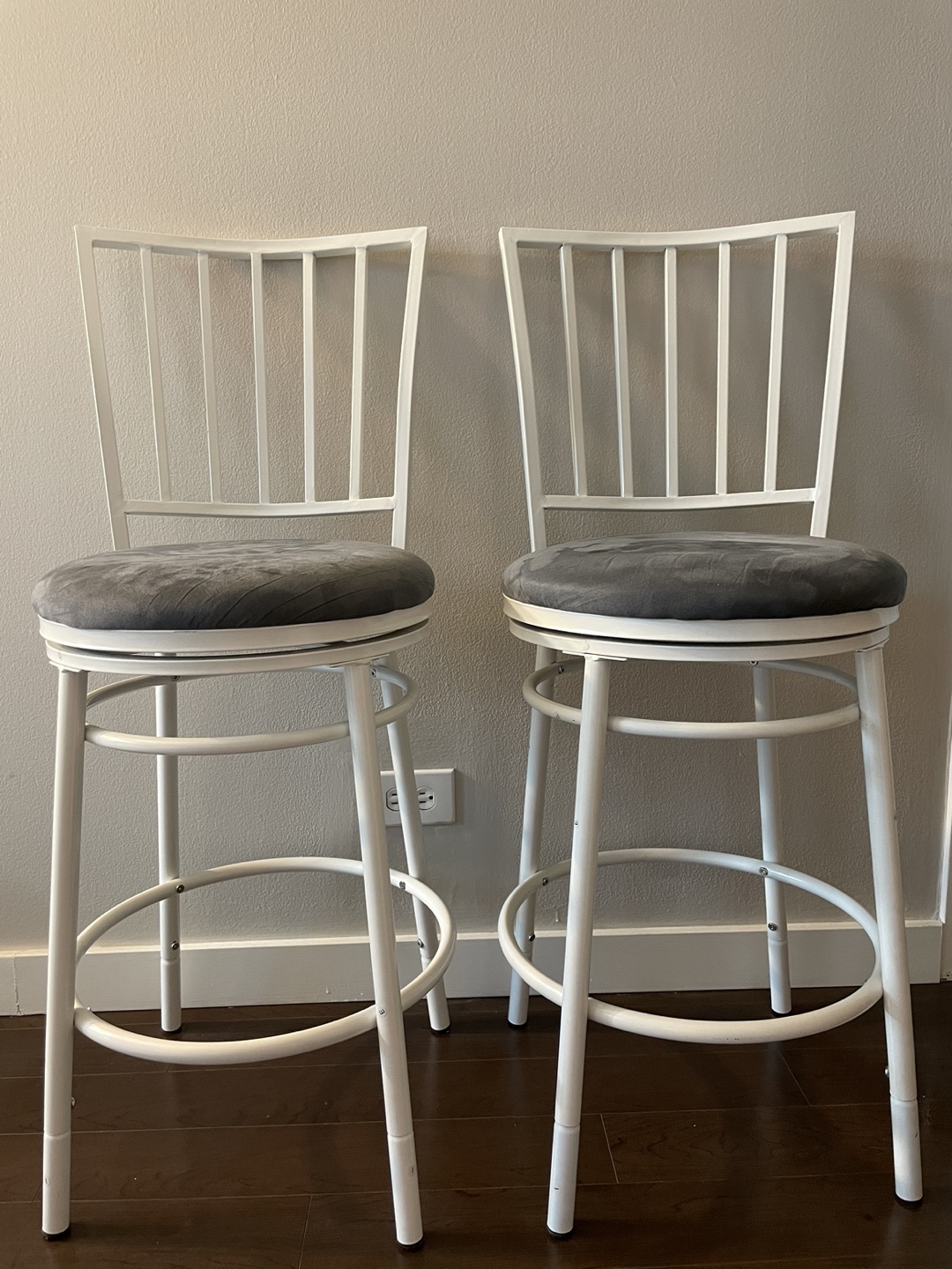 Pair of White Metal Swivel Bar Stools with Grey Cushions