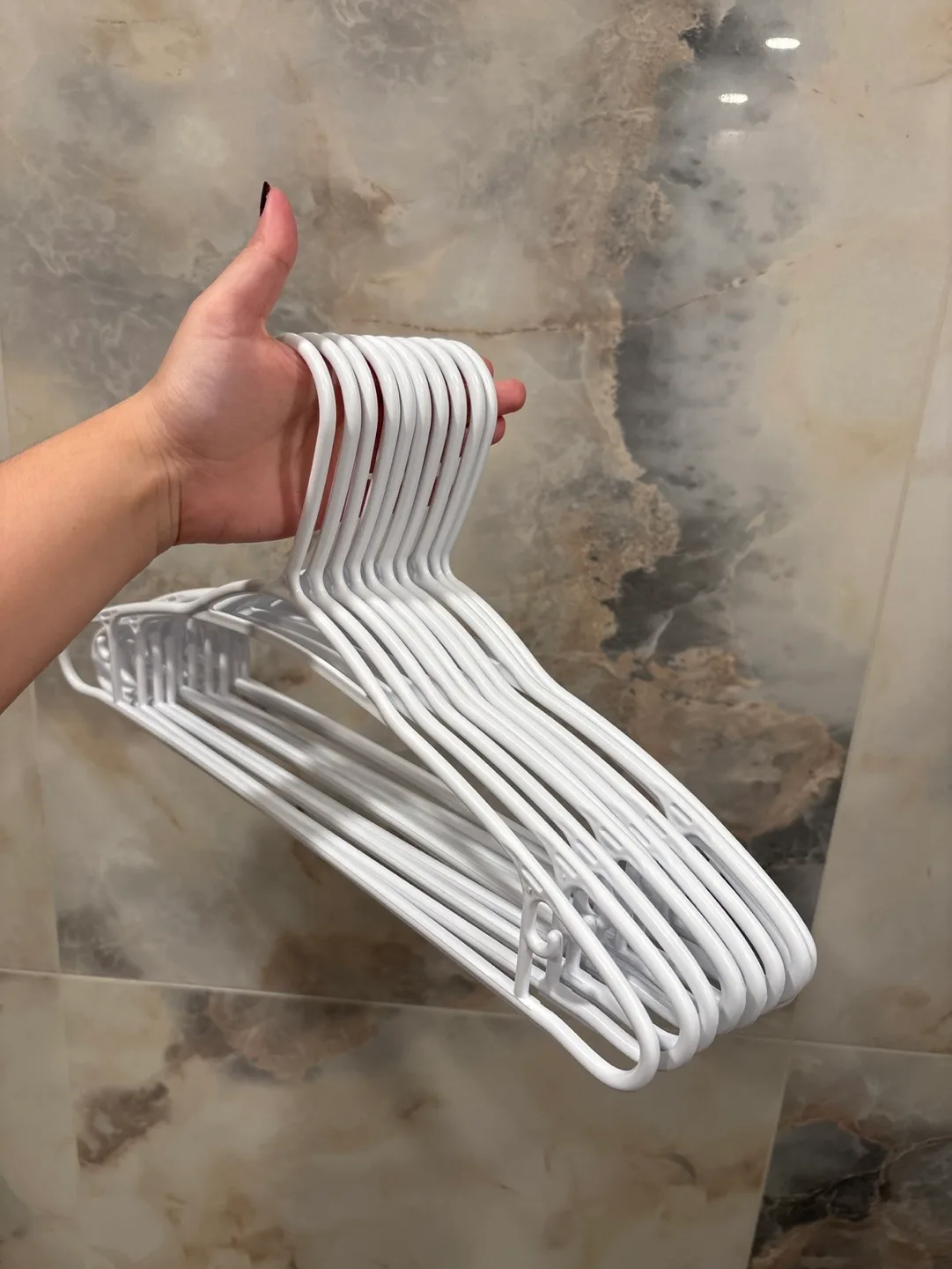 10 white plastic hangers thumbnail