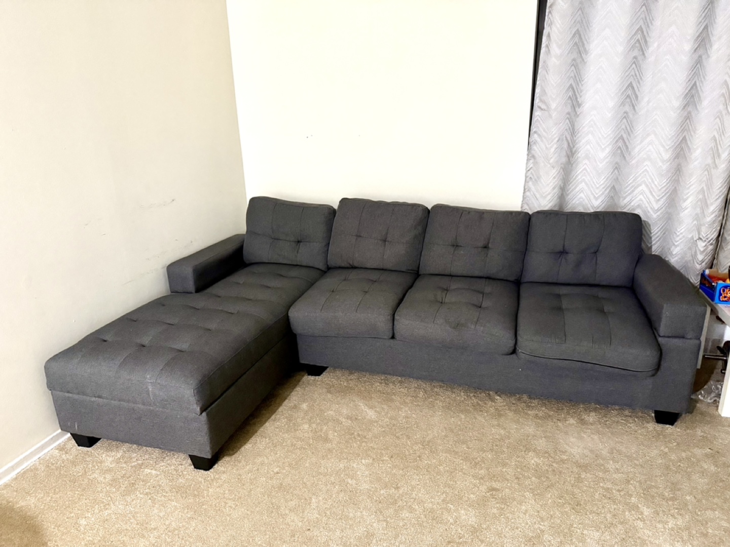 Grey Sectional Sofa with Ottoman and Four Throw Pillows