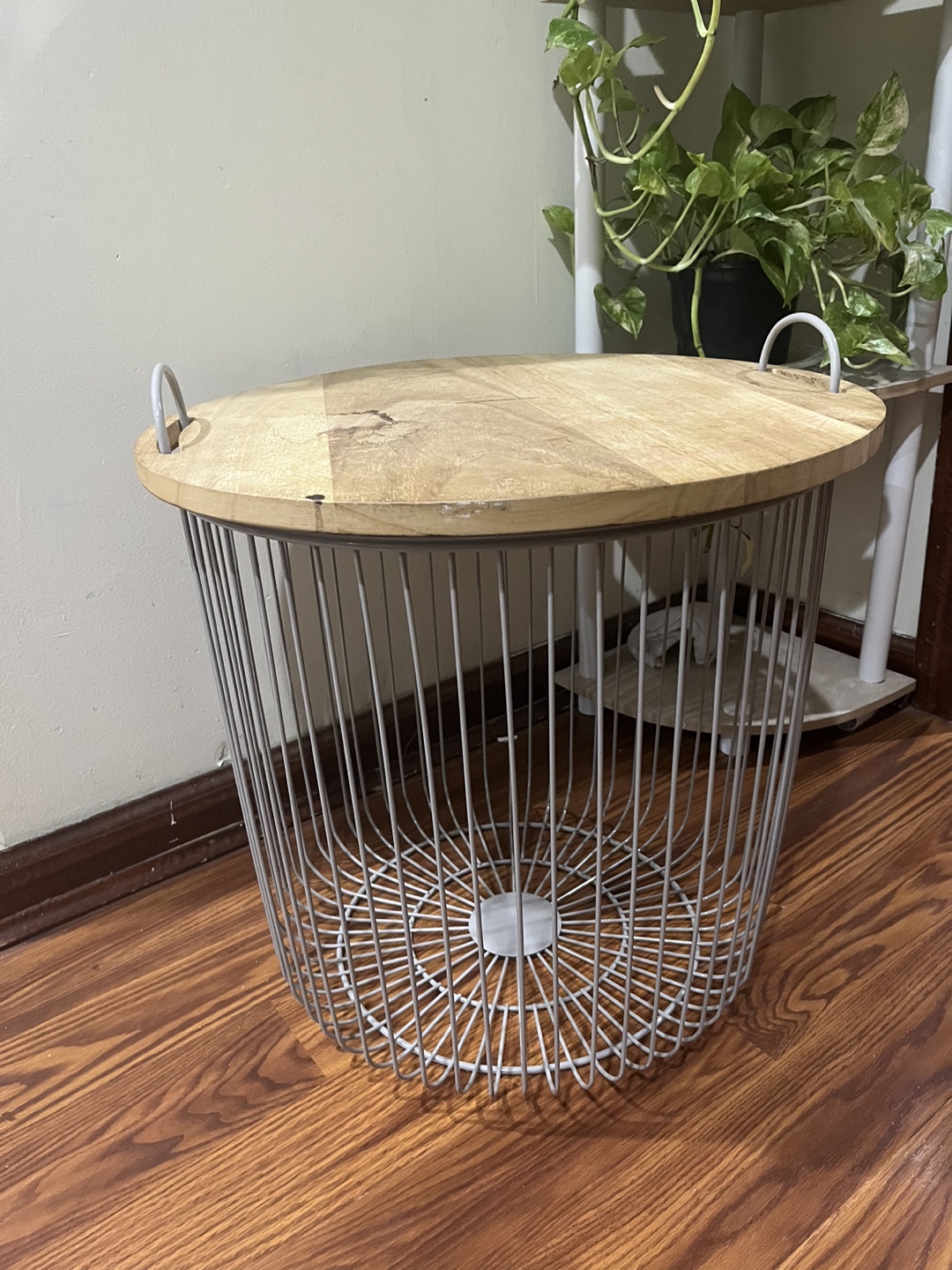 Round gray metal and wood top storage table