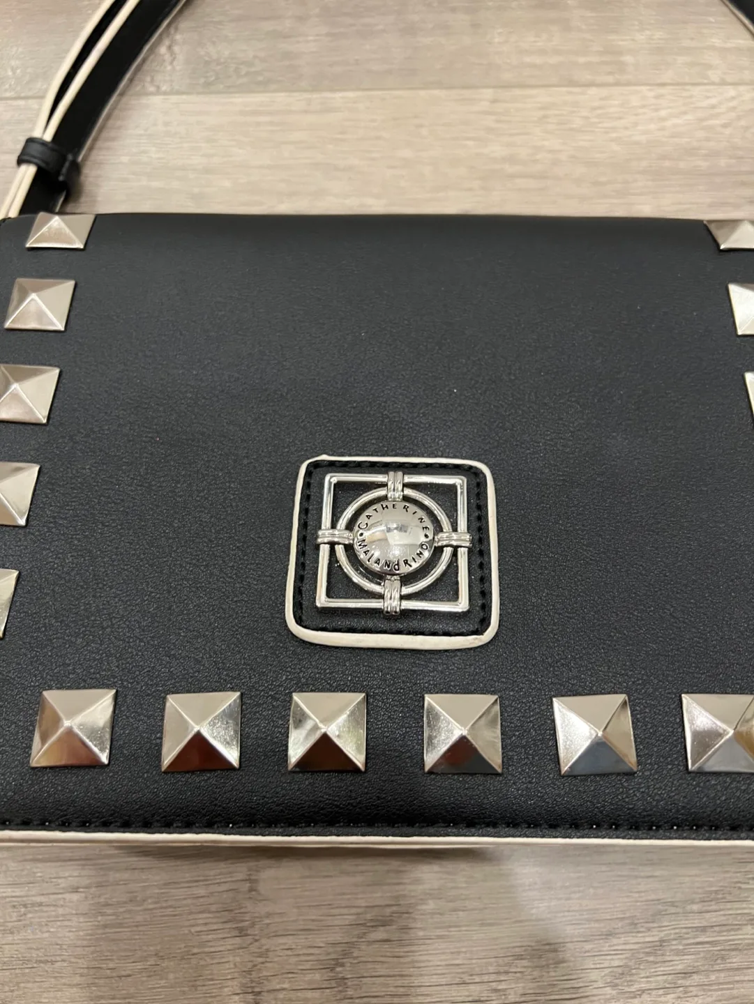 Black studded crossbody bag with colourful tassels image indicator(5)