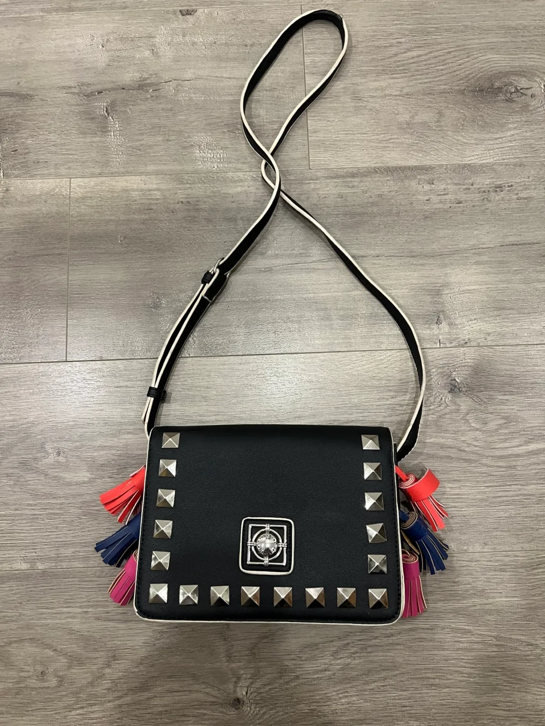 Black studded crossbody bag with colourful tassels image indicator(2)