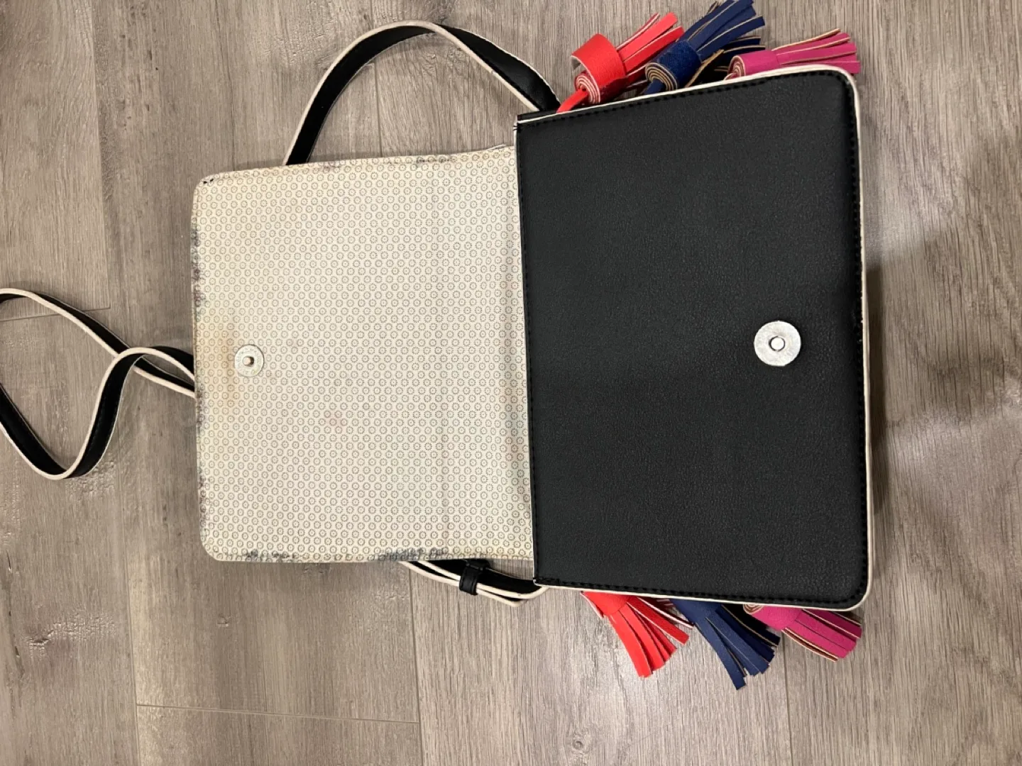 Black studded crossbody bag with colourful tassels image indicator(7)