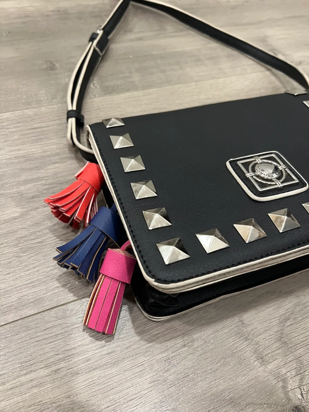 Black studded crossbody bag with colourful tassels image indicator(4)