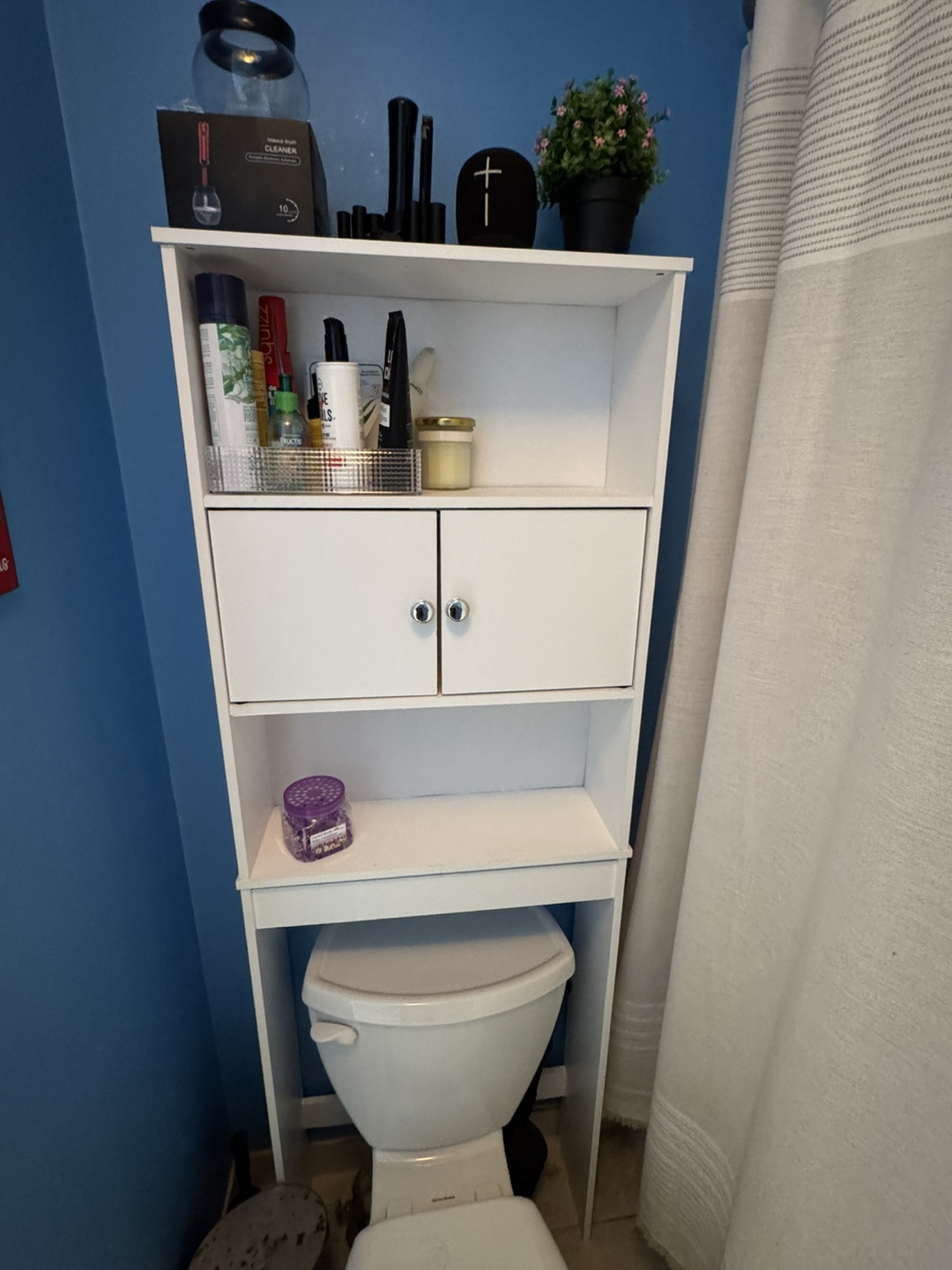 White over-toilet storage cabinet