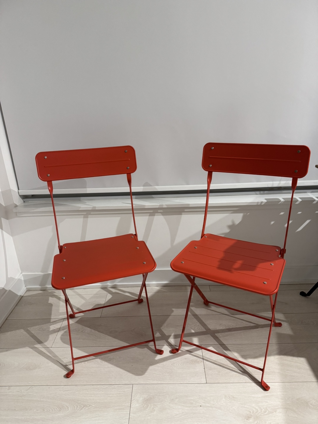 Pair of Red Metal Folding Chairs