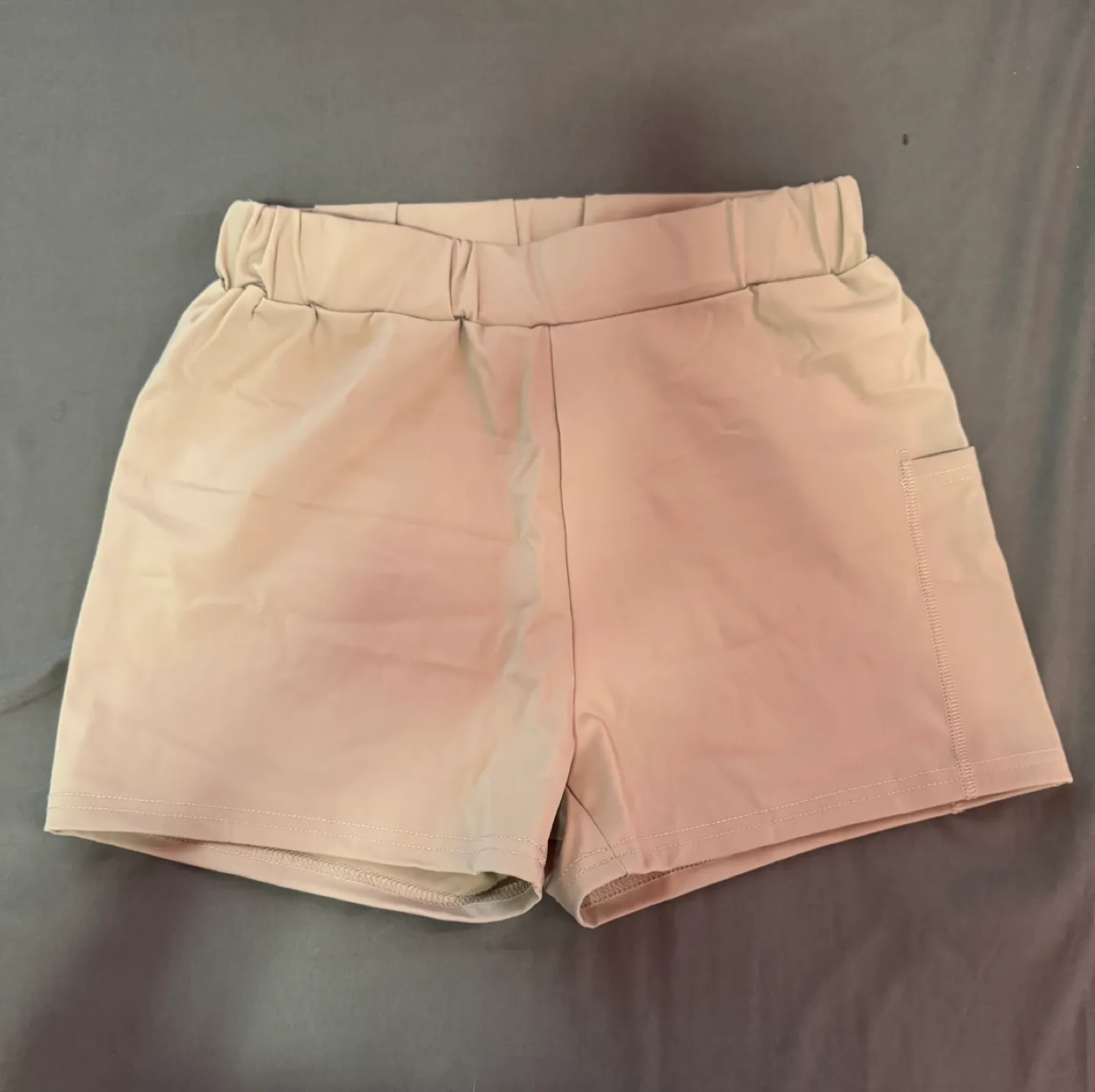 Beige athletic shorts with pocket thumbnail