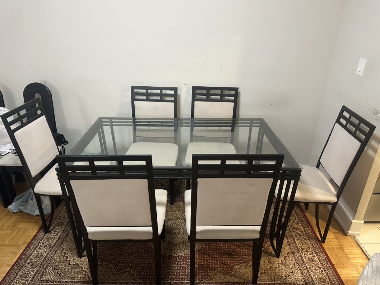 Glass-top dining table with six chairs