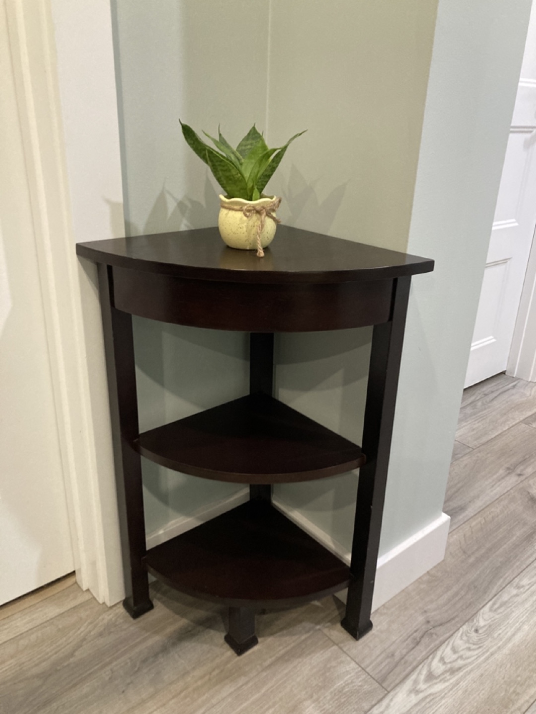 Corner shelf, dark brown wood