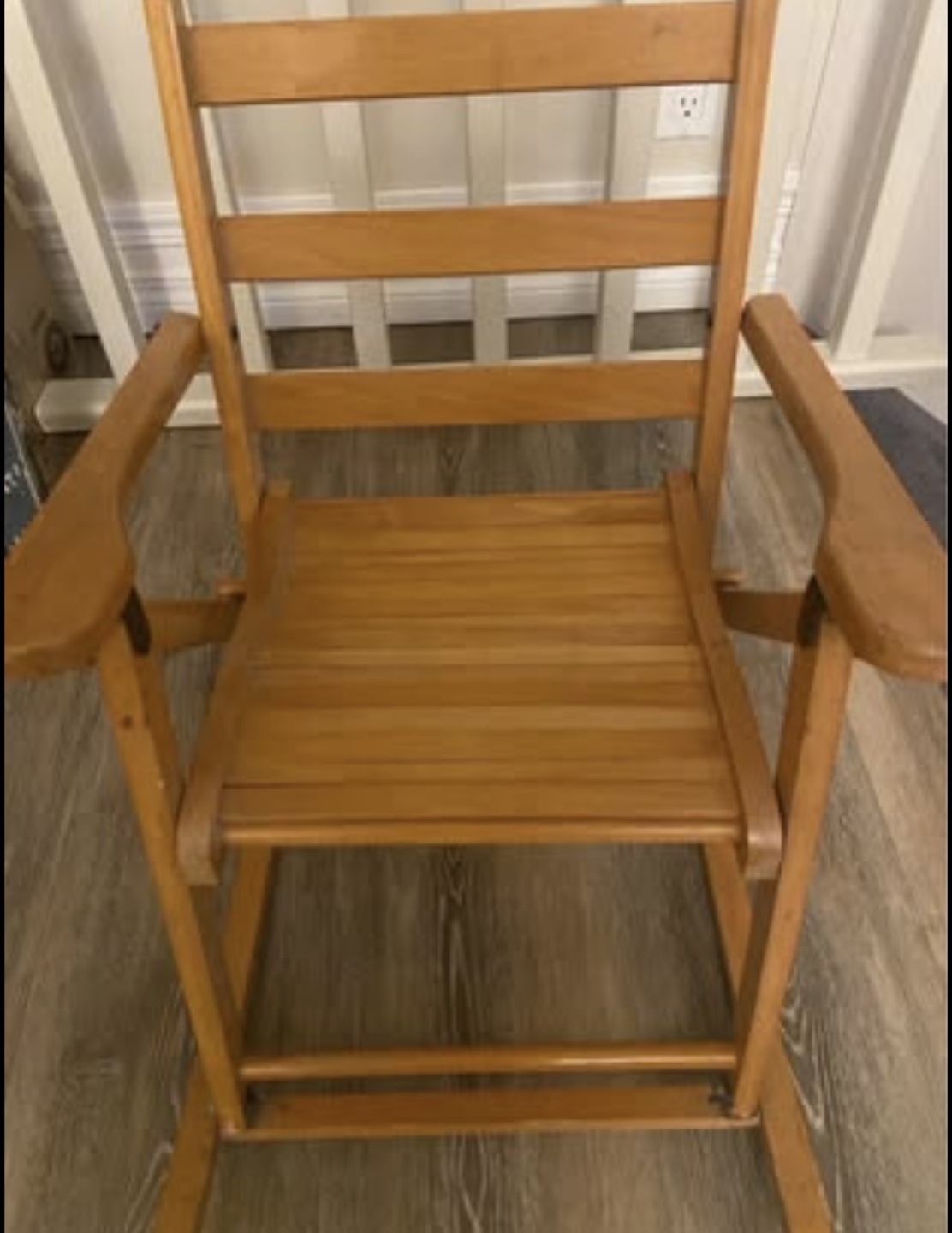 Antique child’s wooden rocking chair