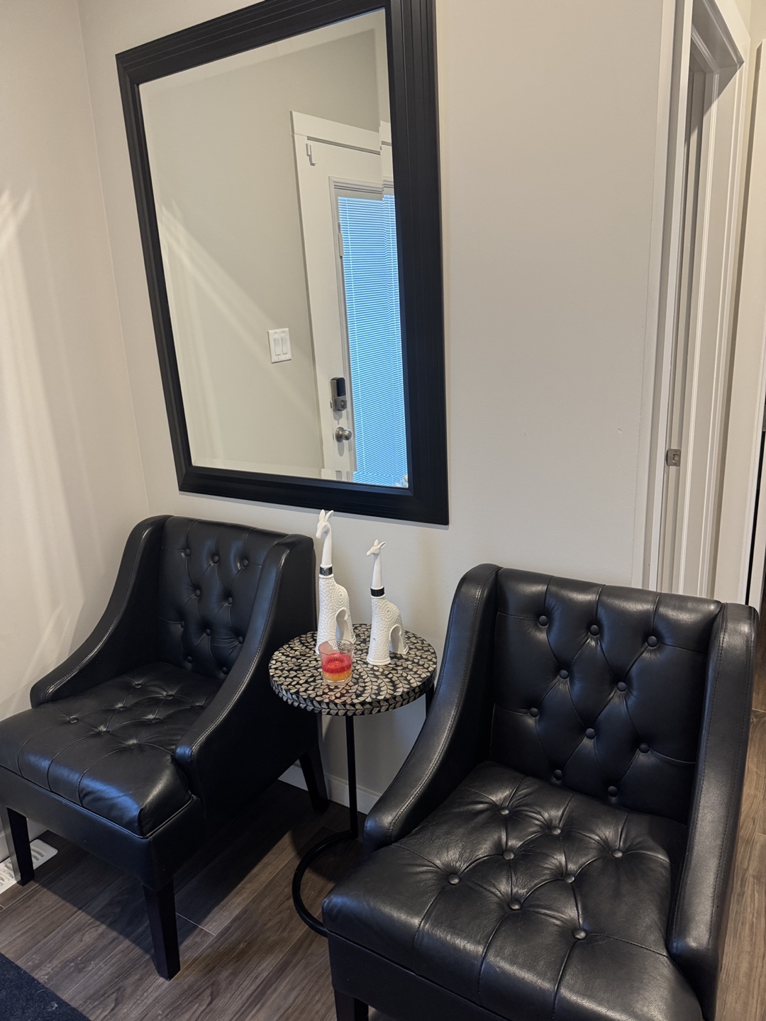 Black Leather Accent Chair and mirror with a side table