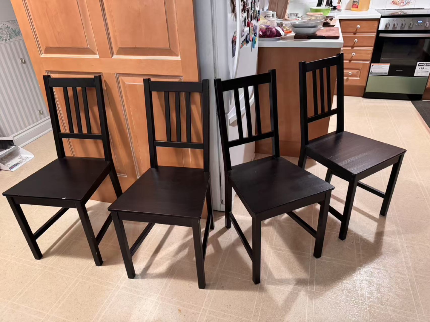Set of four black dining chairs