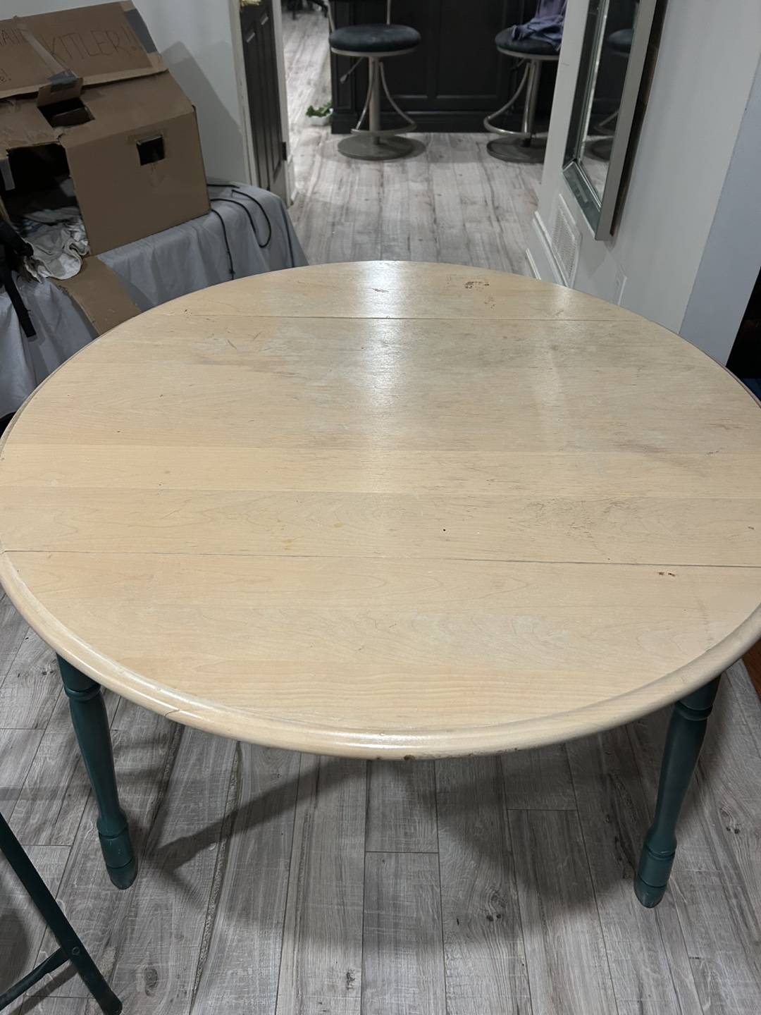 Round Drop-Leaf Table with Teal Legs and foldable chair