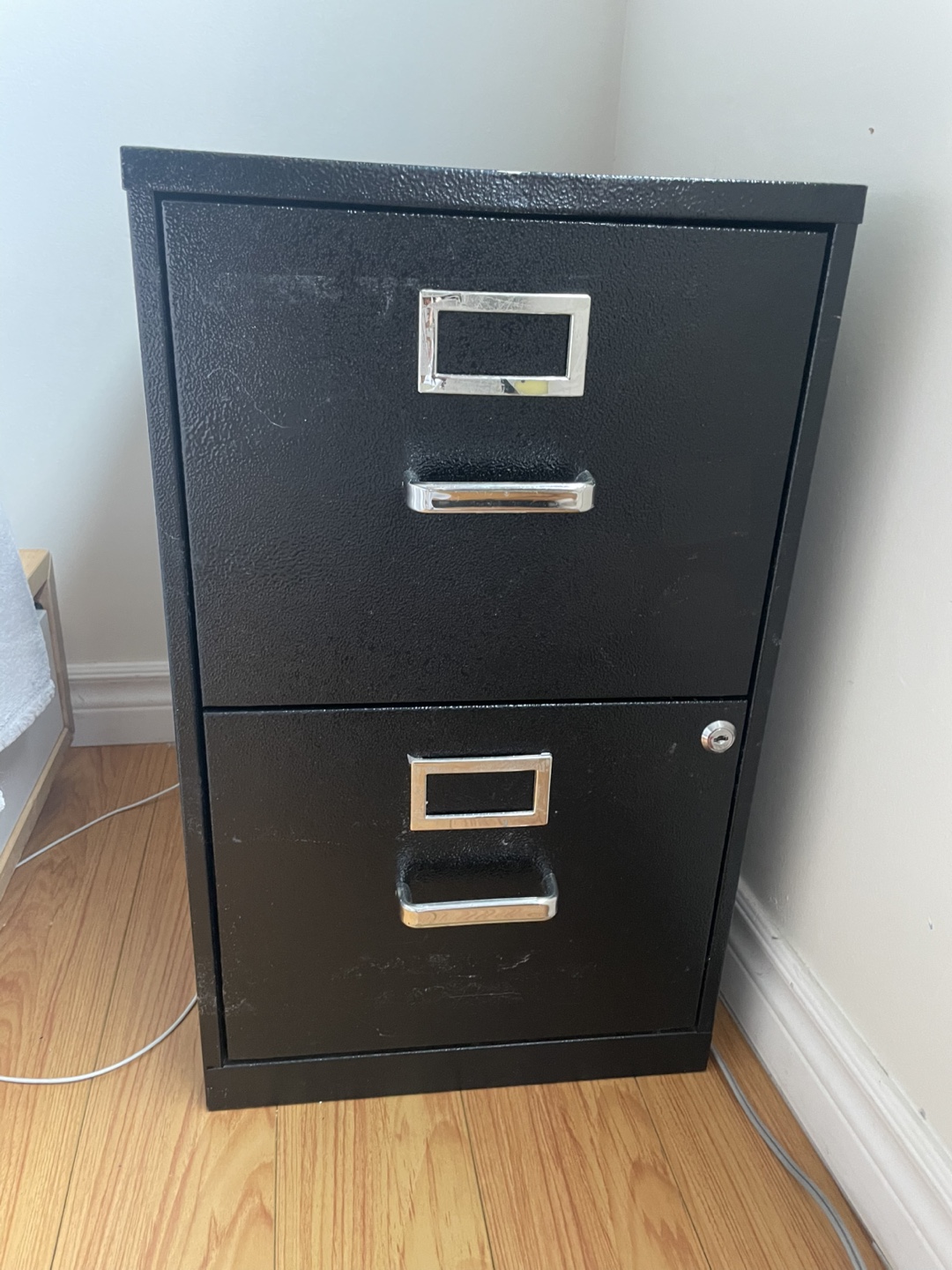 Black metal two-drawer filing cabinet