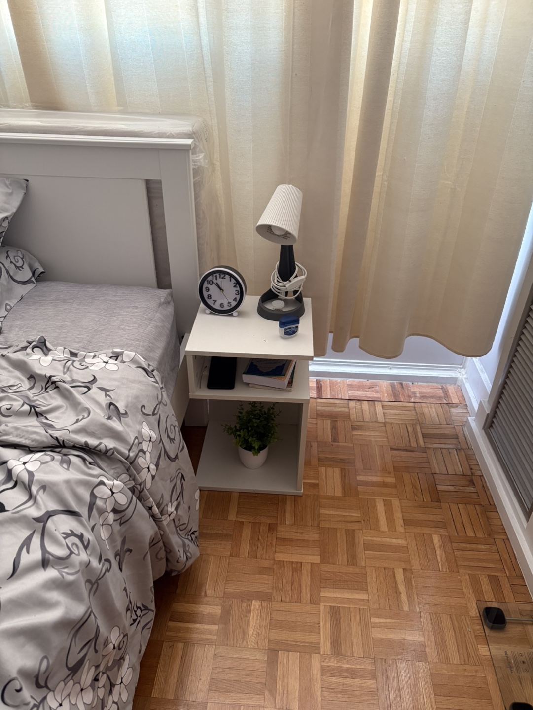 White S shaped Bedside Table