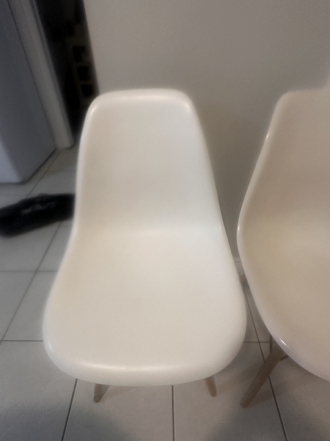 Set of Three White Plastic Dining Chairs with Wooden Legs