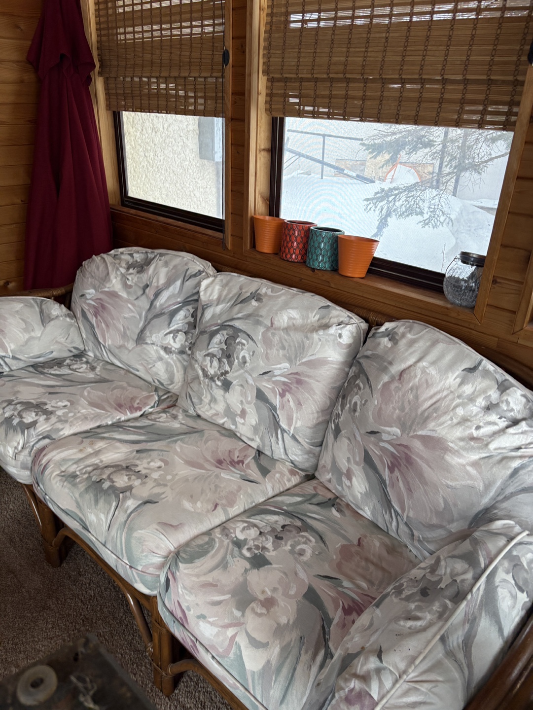 Vintage Rattan Sofa with Floral Cushions