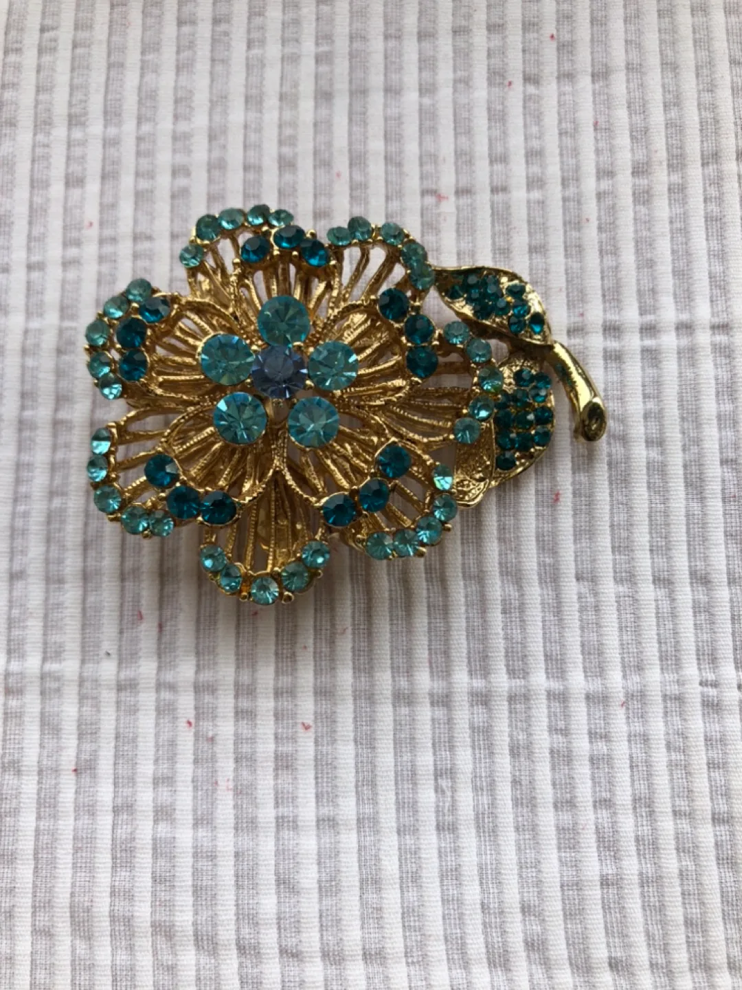 Gold Tone Flower Brooch with Blue Rhinestones image indicator(3)