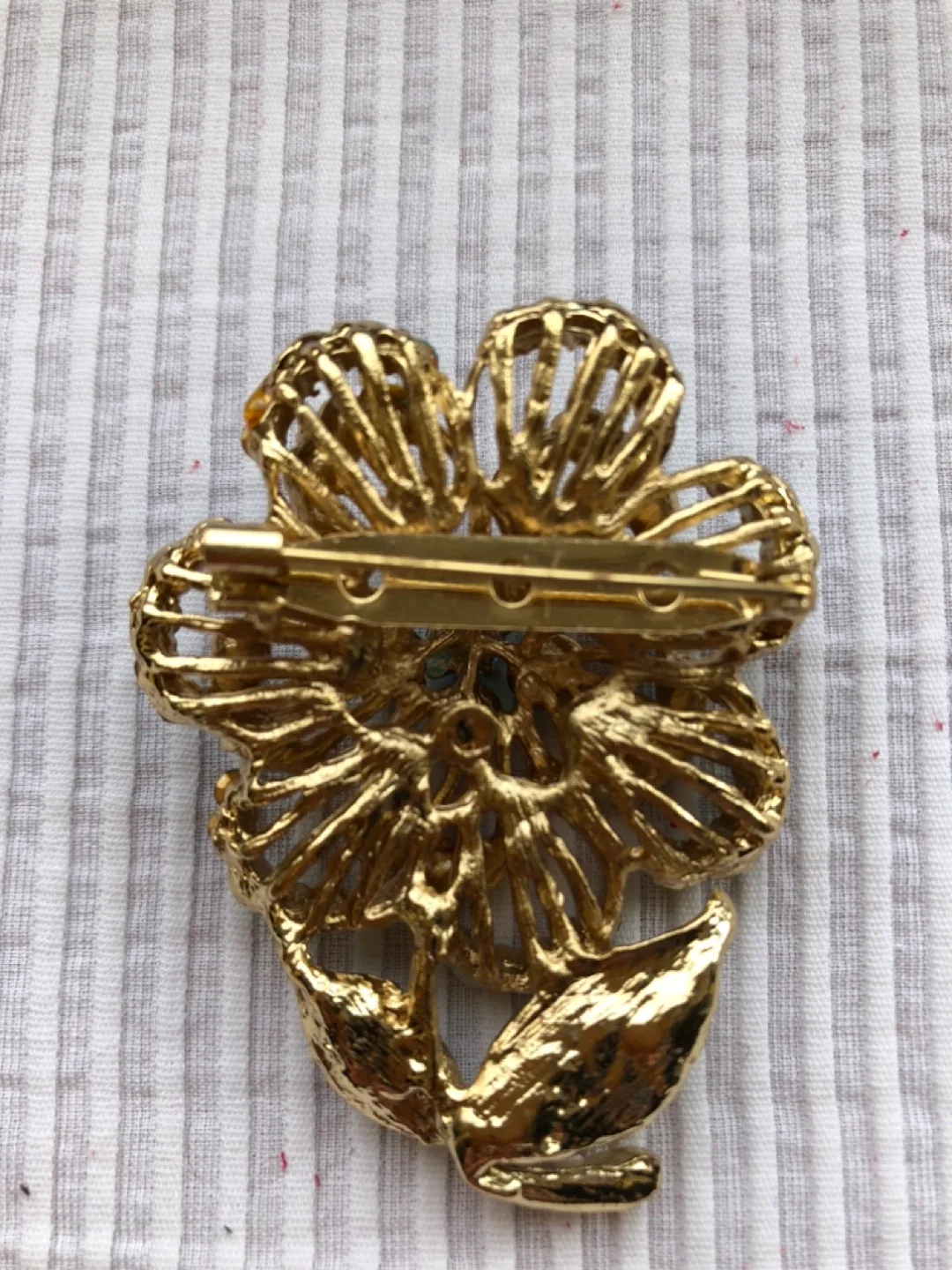 Gold Tone Flower Brooch with Blue Rhinestones image indicator(2)