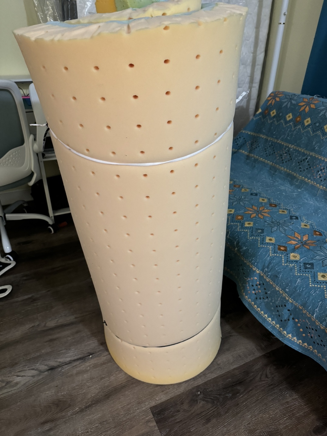 Rolled up mattress topper