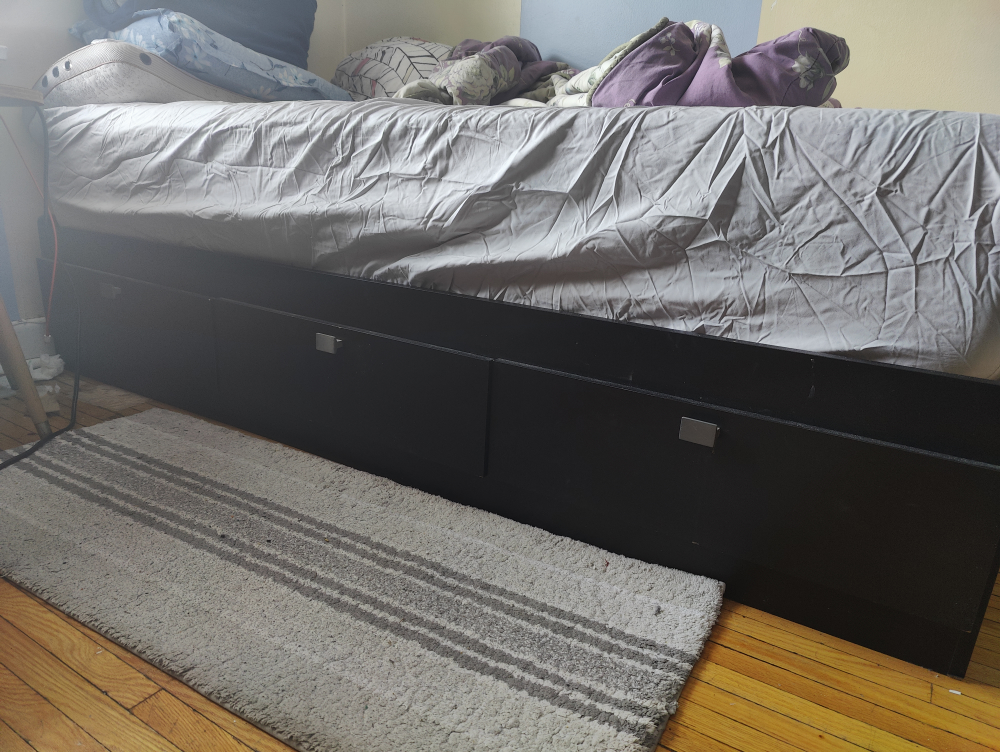 Black platform bed frame with drawers