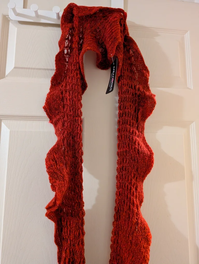 Rust-coloured Knitted Scarf with Pom-poms image indicator(2)