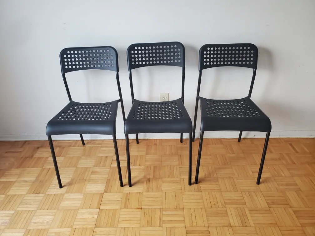 Three Black Plastic Chairs thumbnail