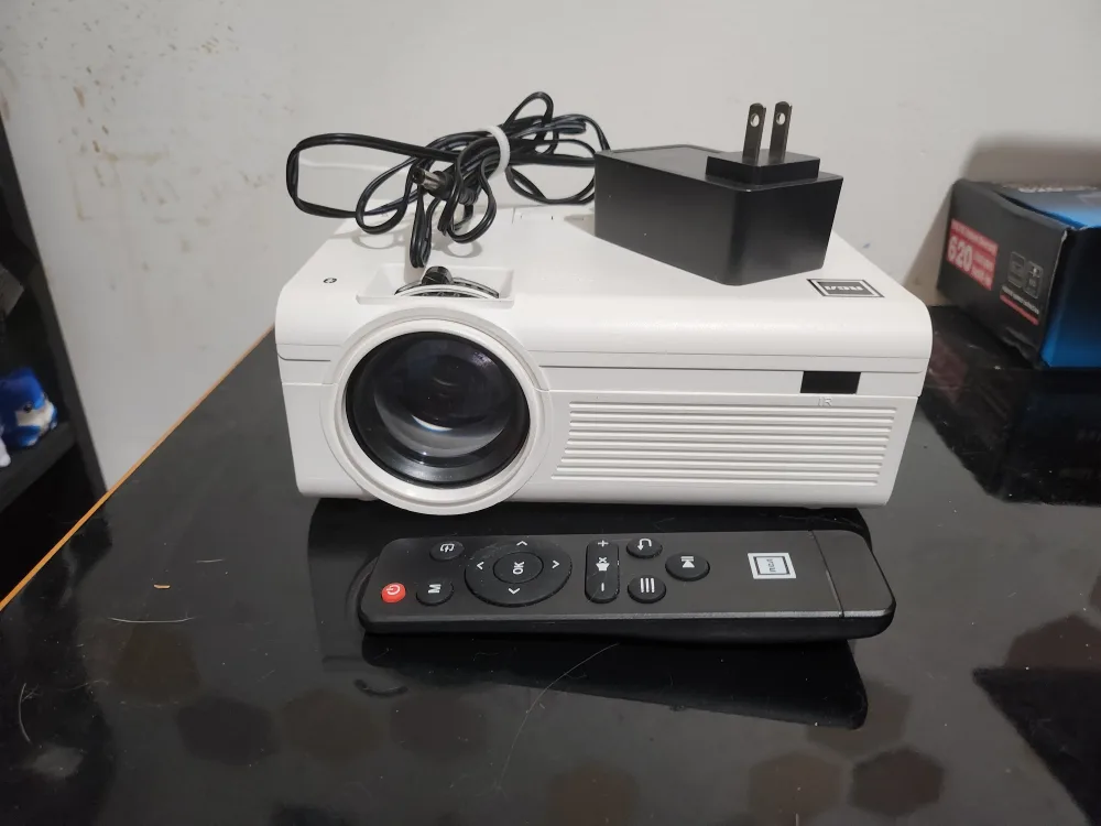 RCA 21 Mini Projector with Bluetooth and 100" Fold-Up Screen image indicator(2)