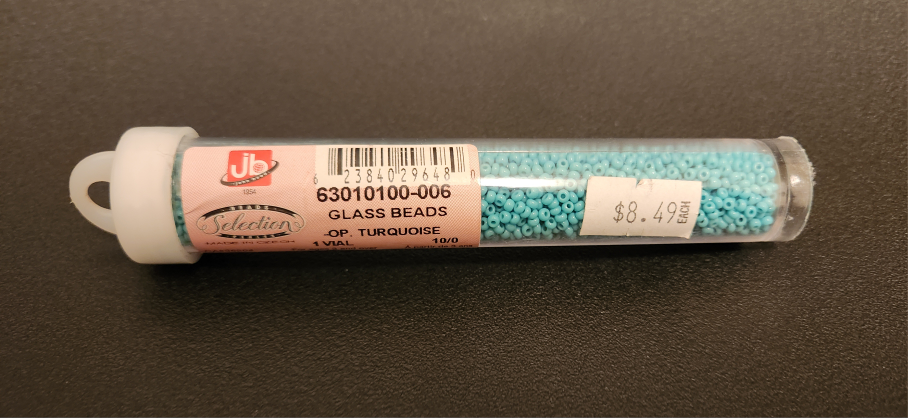 Tube of blue glass beads