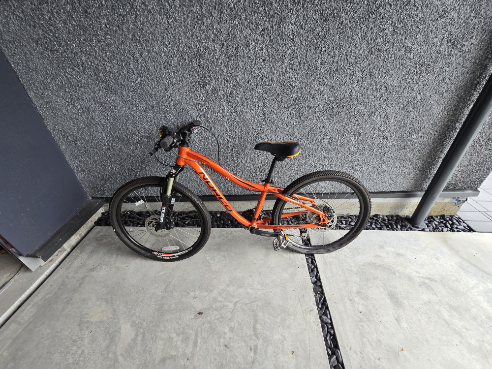 Orange Norco mountain bike