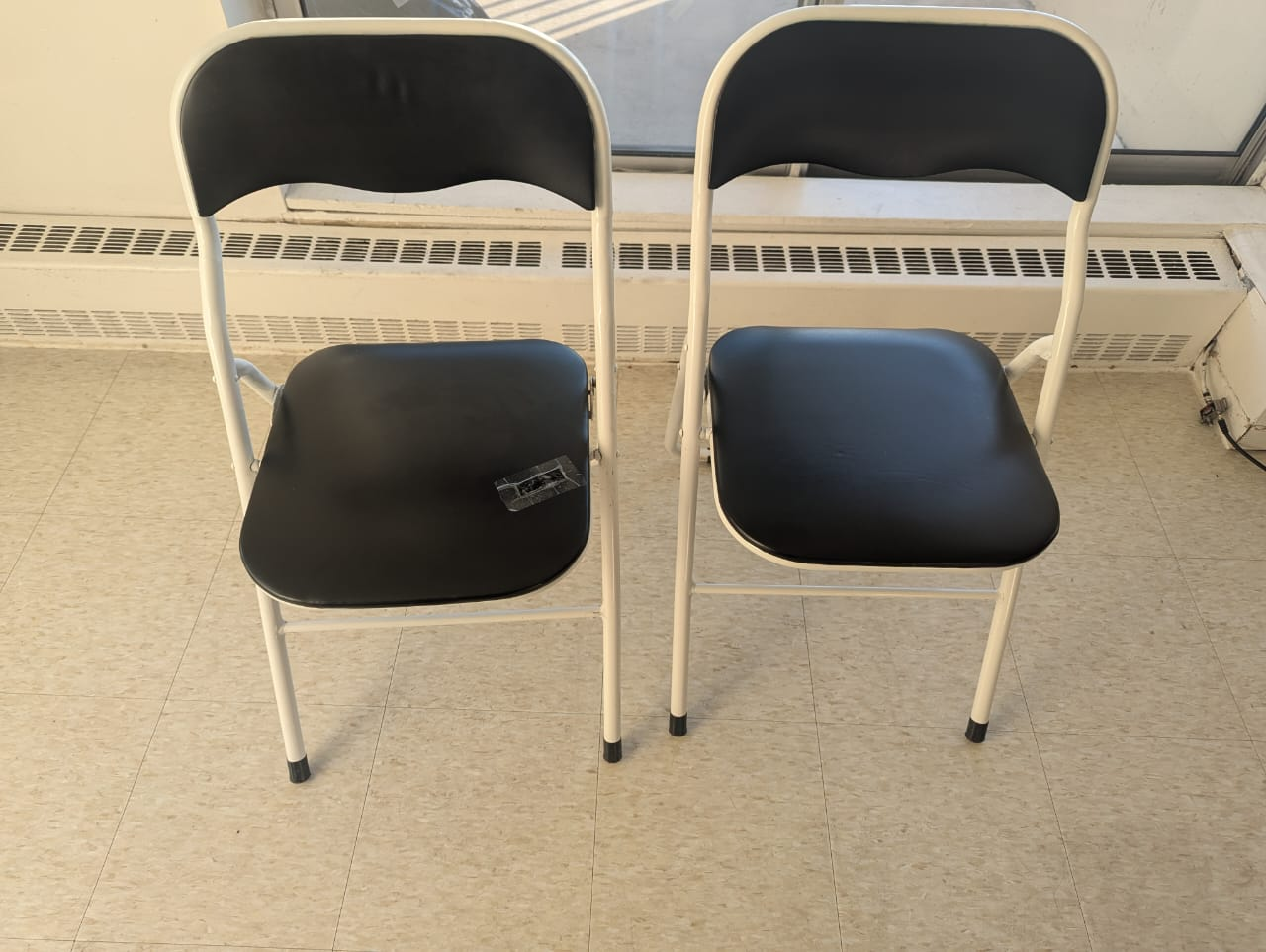 Pair of Black and White Folding Chairs