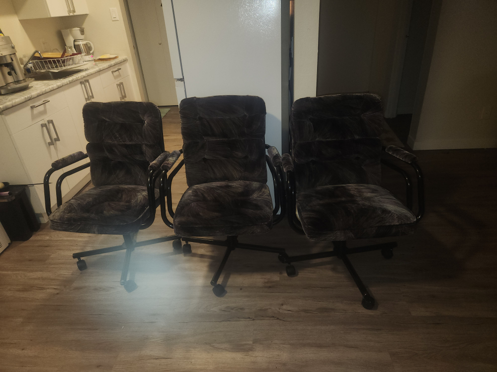 Three Vintage Swivel Armchairs