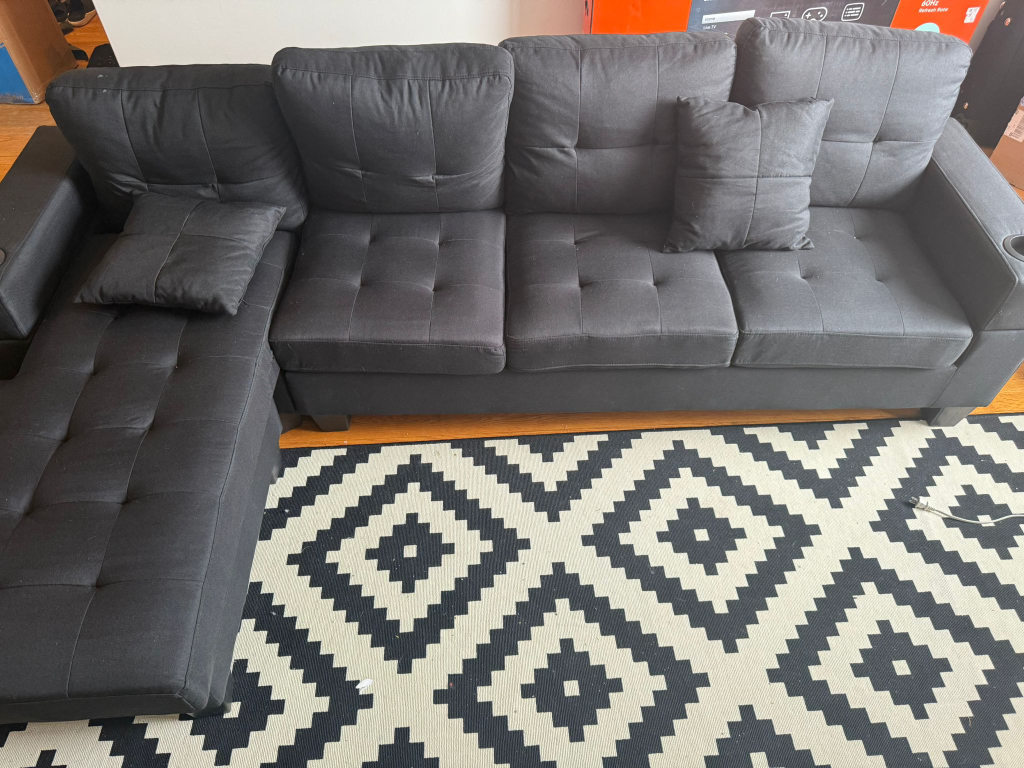 Black fabric sectional sofa with chaise lounge