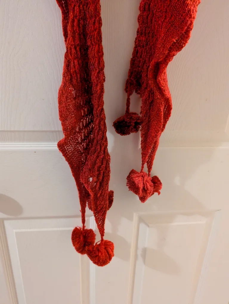 Rust-coloured Knitted Scarf with Pom-poms image indicator(3)