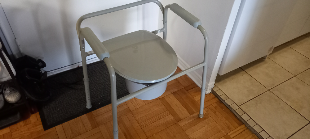 Grey bedside commode with armrests - photo 2