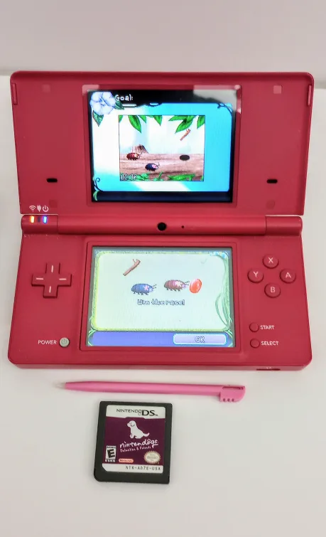 Nintendo DSi Pink w/ Stylus, Charger & 2 game carts. image indicator(2)