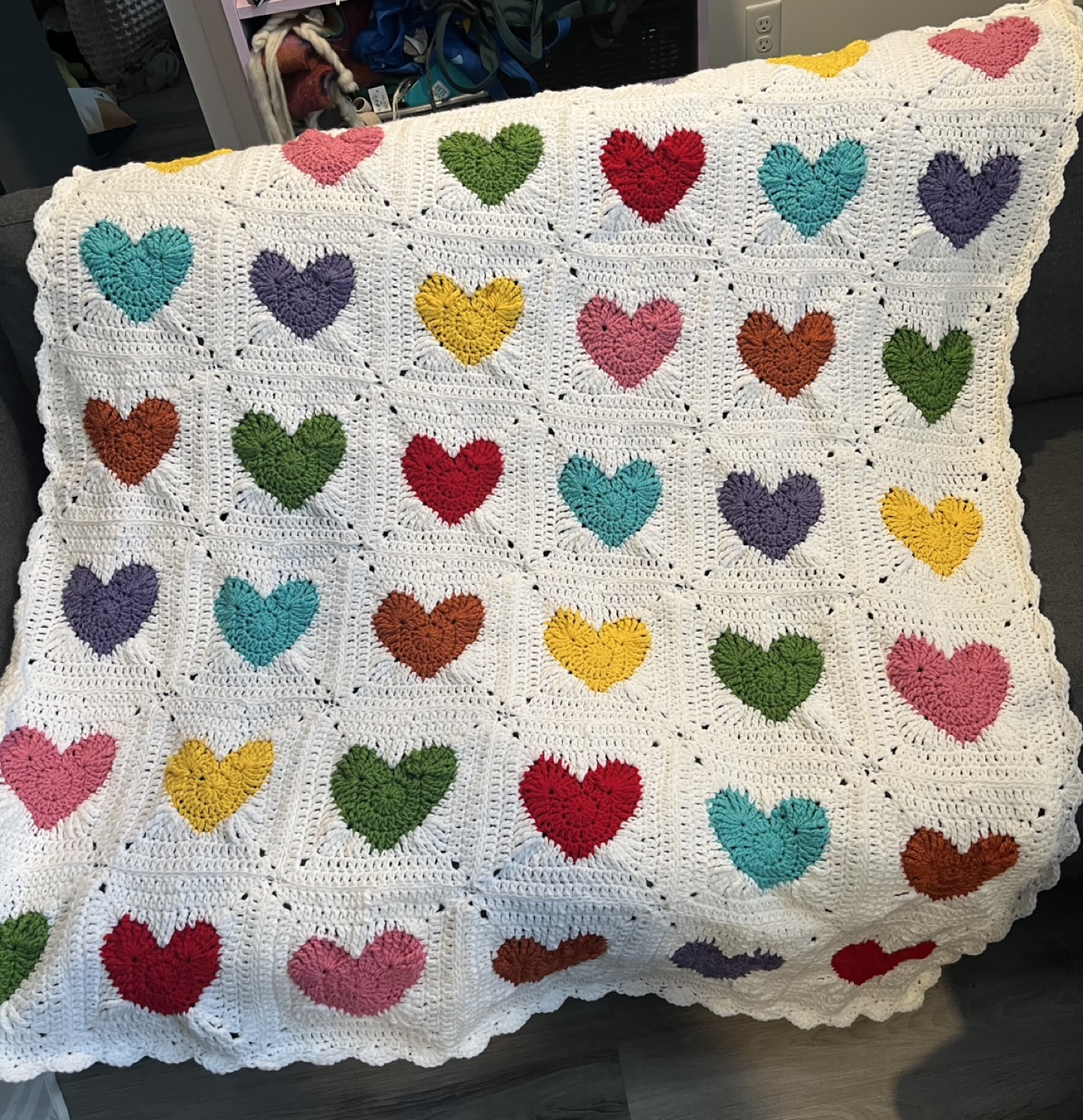 Handmade multicoloured heart crochet blanket