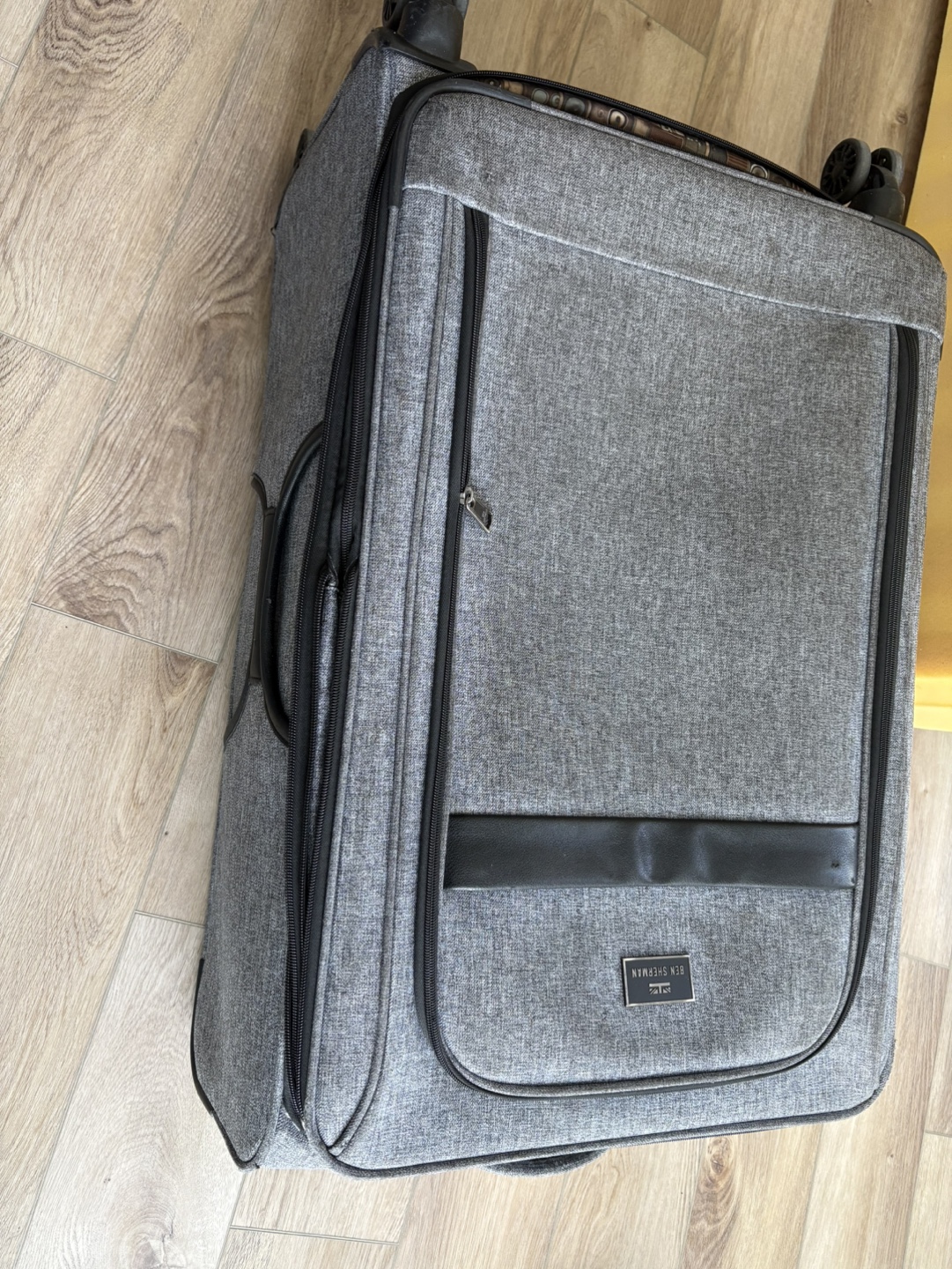 Rolling suitcases, handles damaged