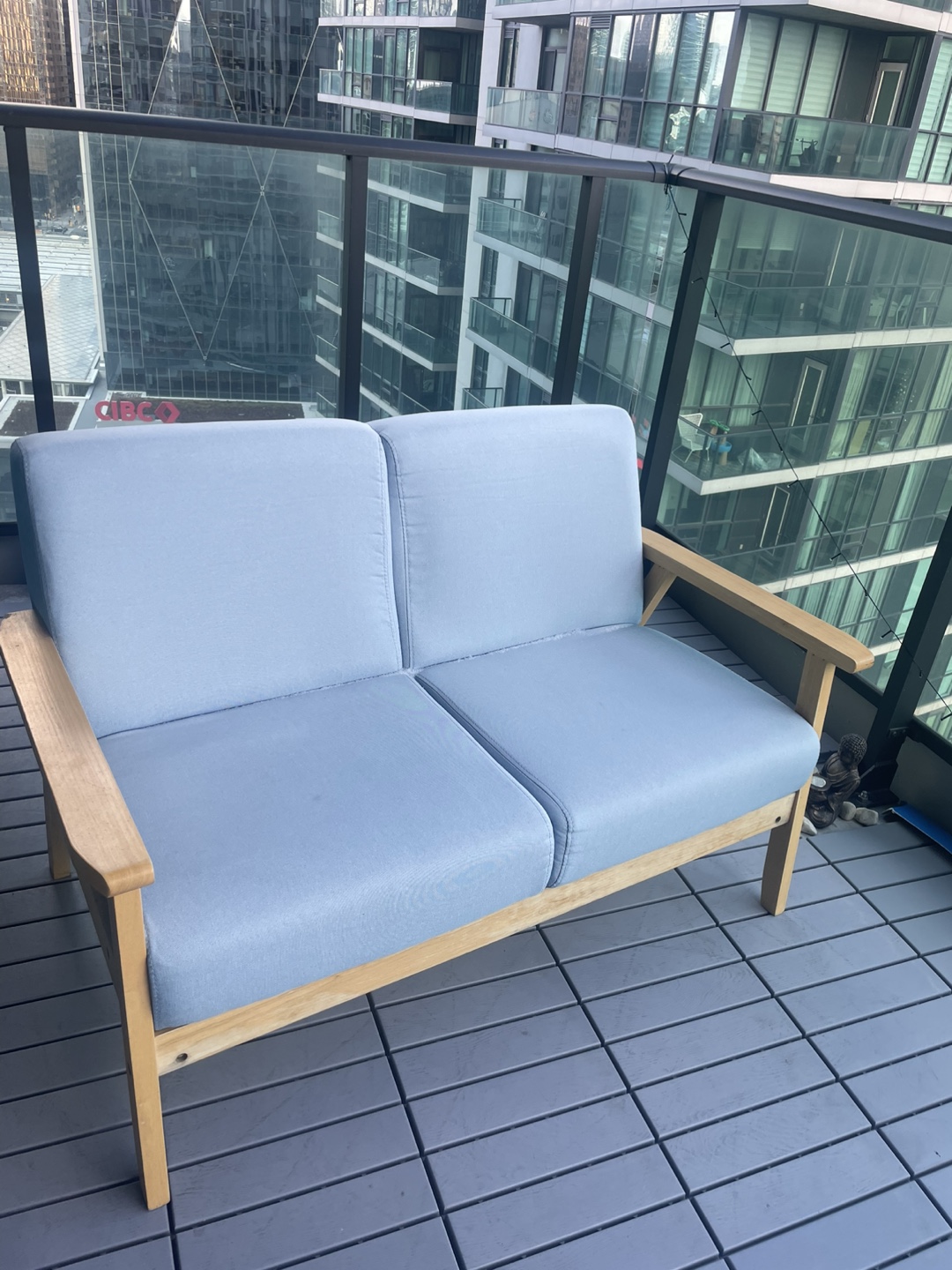 Light Blue Two-Seater Sofa with Wooden Frame