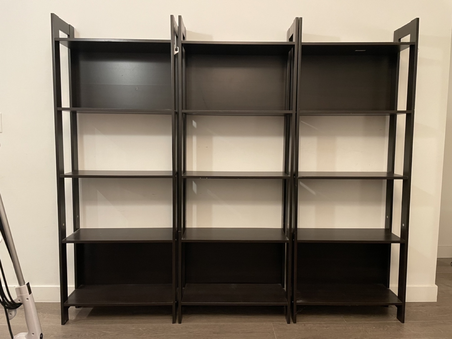 Three Dark Brown Bookshelves