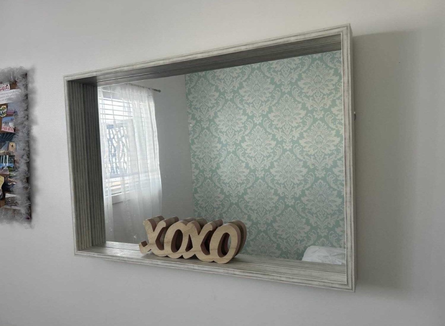 Large rectangular wall mirror with white frame