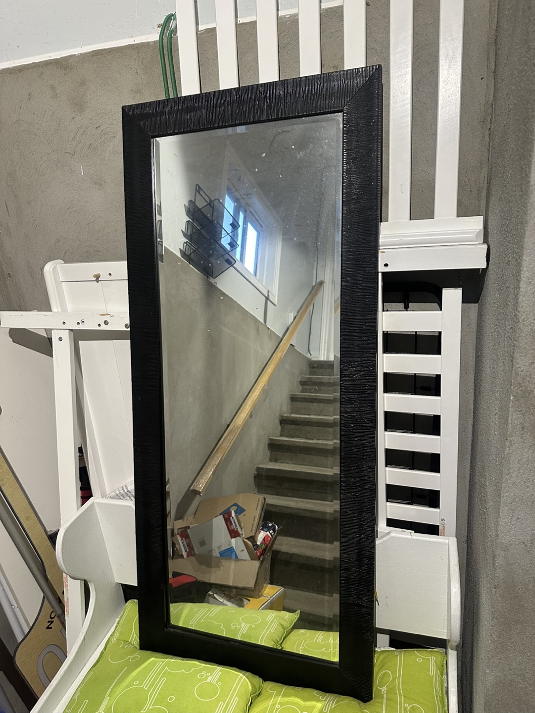Black framed full-length mirror