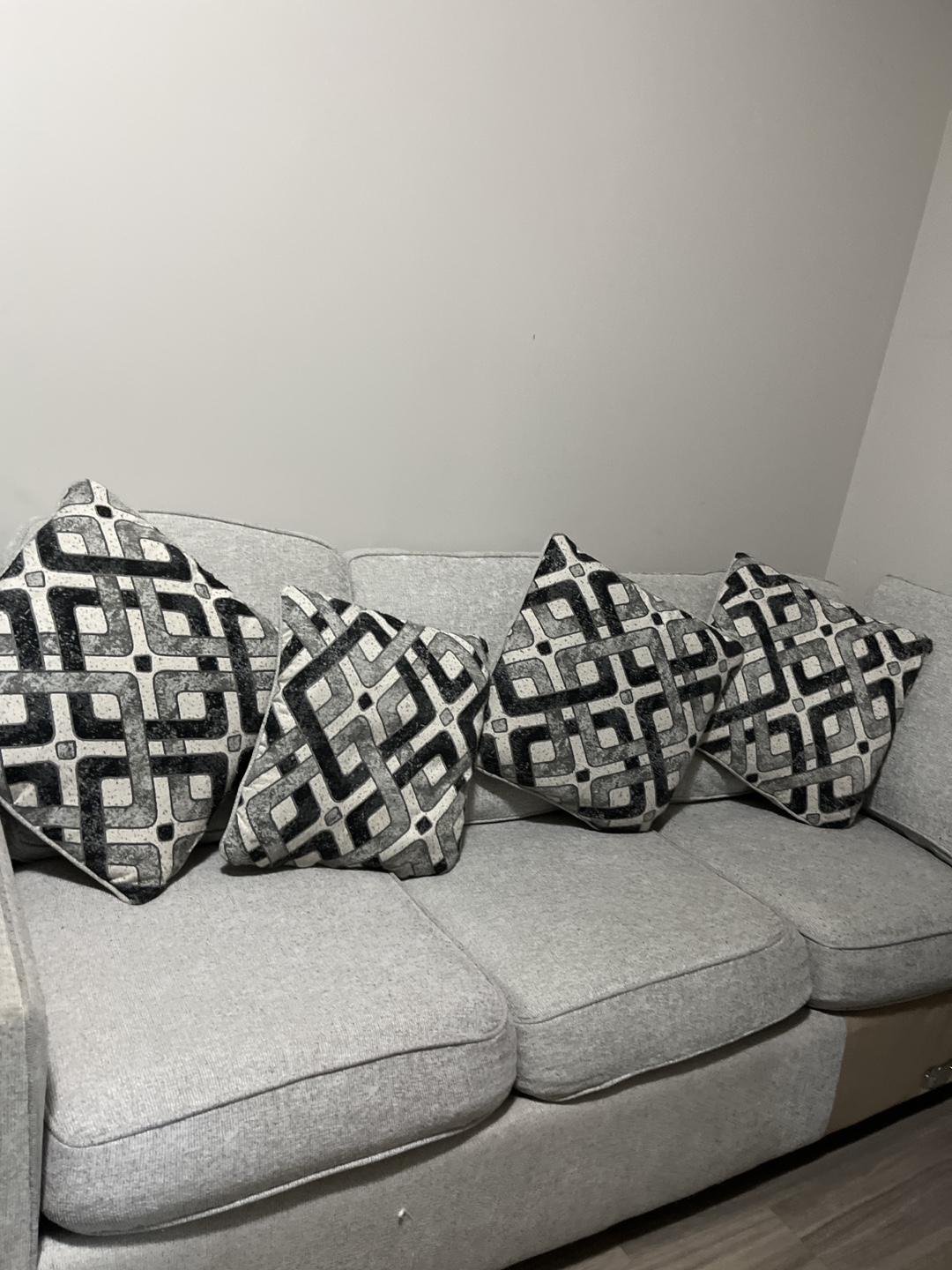 Grey Fabric Sofa with Four Throw Pillows